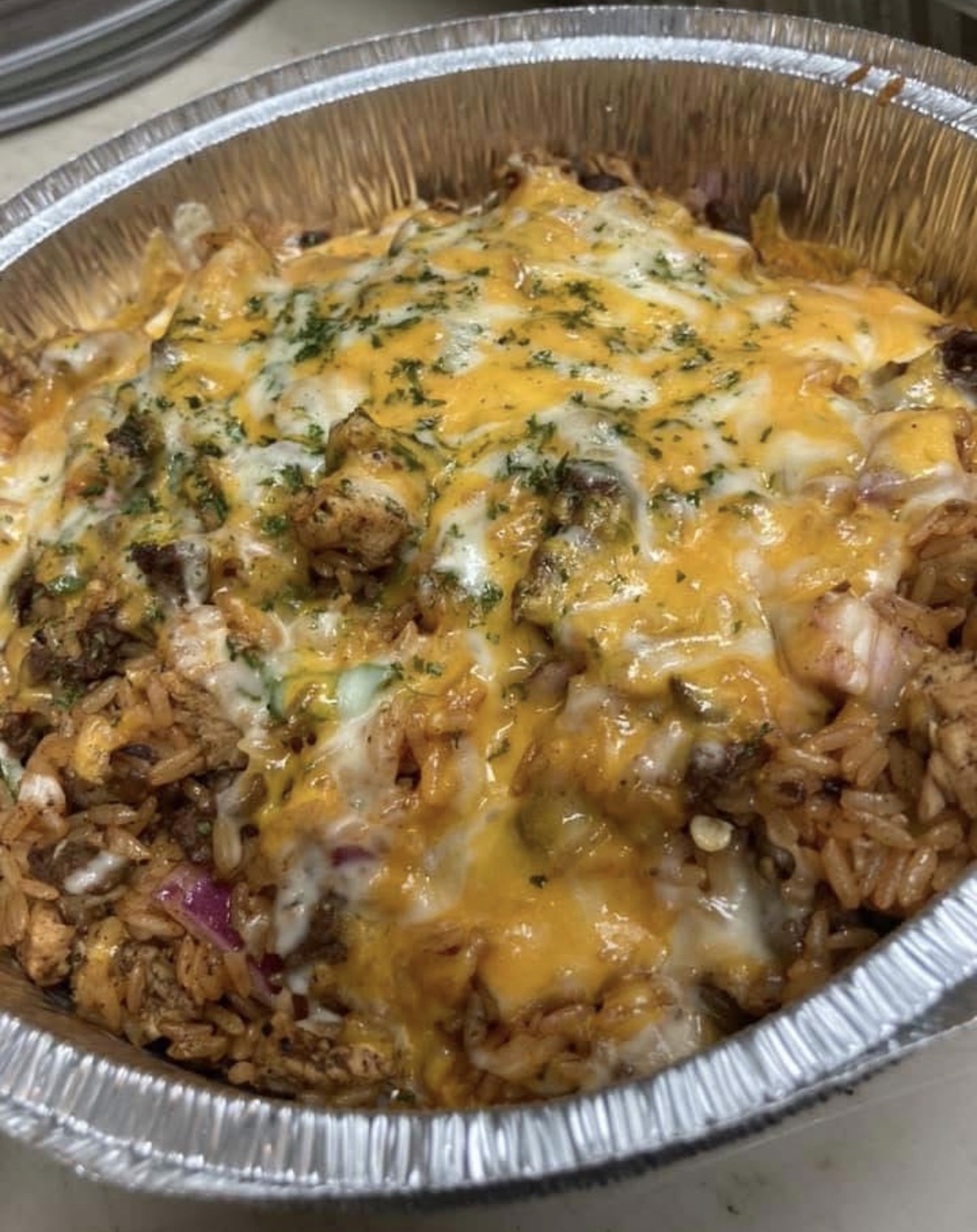 Baked barbecue dish with melted cheese